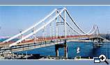 Pedestrian suspended bridge across the river of Dnieper in Kiev